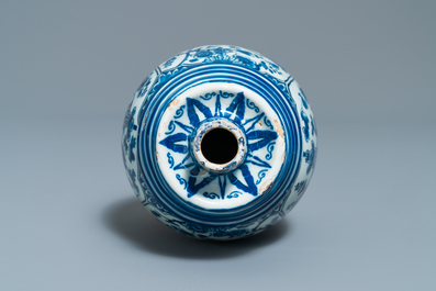 A Dutch Delft blue and white barrel-shaped gin flask with chinoiserie design, dated 1711