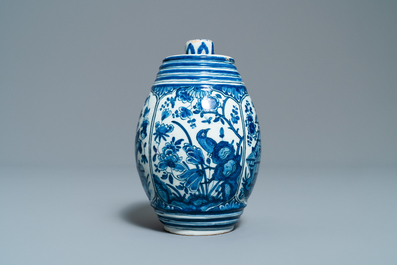 A Dutch Delft blue and white barrel-shaped gin flask with chinoiserie design, dated 1711