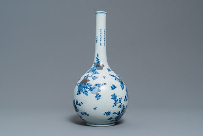 A Chinese blue, white and copper-red 'peaches' bottle vase with inscription, Kangxi