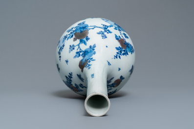 A Chinese blue, white and copper-red 'peaches' bottle vase with inscription, Kangxi