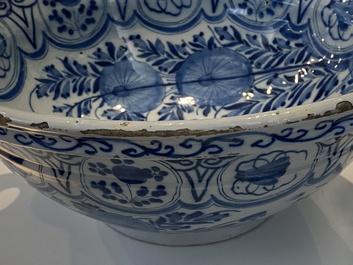 A large Dutch Delft blue and white two-handled chinoiserie bowl, 18th C.