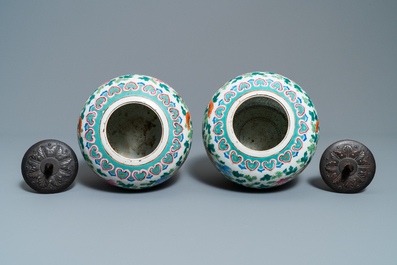 A pair of Chinese famille rose ginger jars with phoenixes, 19th C.
