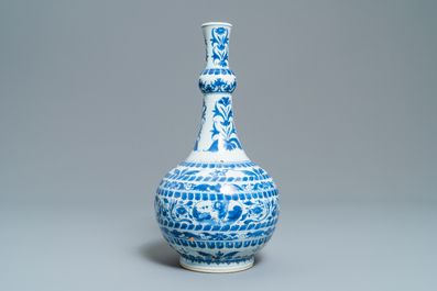 A Chinese blue and white bottle vase with figural medallions, Transitional period