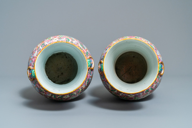 A pair of Chinese Canton famille rose pink-ground vases, 19th C.