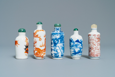 Five Chinese blue and white, iron- and copper-red snuff bottles, 19th C.