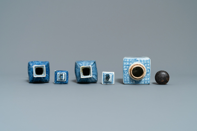 A pair of square Chinese blue and white covered vases and a tea caddy, Kangxi