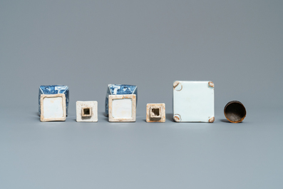 A pair of square Chinese blue and white covered vases and a tea caddy, Kangxi