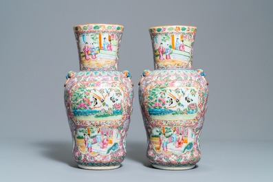 A pair of Chinese Canton famille rose pink-ground vases, 19th C.