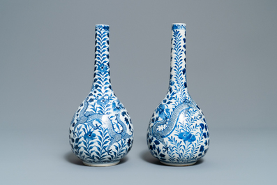 A pair of Chinese blue and white bottle vases with dragons, 19th C.