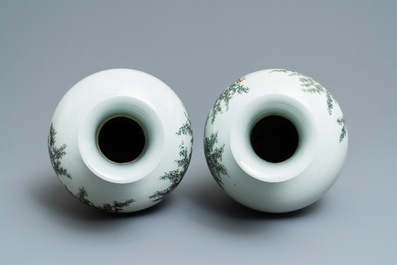 A pair of Chinese famille rose vases with go-players, Qianlong mark, 19/20th C.