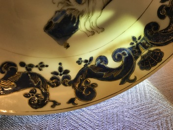 A pair of Chinese Pronk studio eggshell plates with parrots, Yongzheng/Qianlong