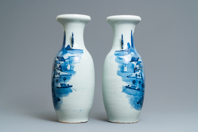 A pair of Chinese blue and white 'landscape' vases, 19th C.