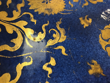 A Chinese powder blue and gilt dish with floral design, Kangxi