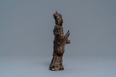 A Chinese bronze figure of a dignitary, Ming
