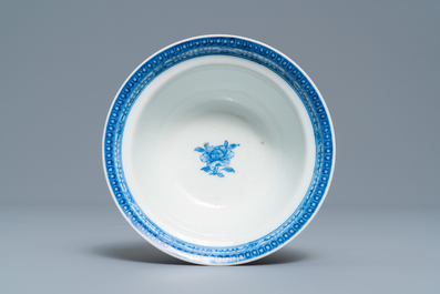 A Chinese blue and white bowl with an unusual scene with slaves, Qianlong