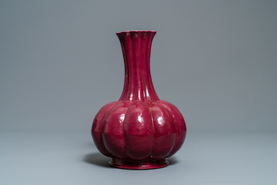 A Chinese monochrome ruby red vase, Qianlong mark, 19th C.