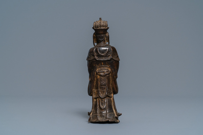 A Chinese bronze figure of a dignitary, Ming