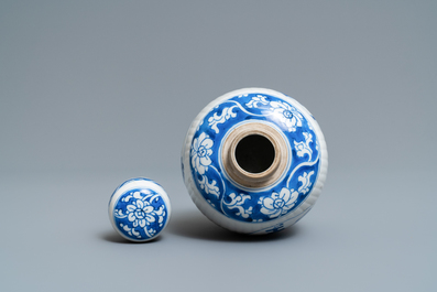 A Chinese ribbed blue and white jar and cover, Kangxi