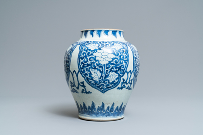 Een Chinese blauw-witte vaas met florale panelen, Kangxi