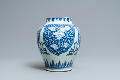 Een Chinese blauw-witte vaas met florale panelen, Kangxi