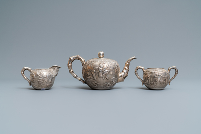 A Chinese silver teapot, cream jug and sugar jar, marked Luen Wo - Shanghai, late 19th C.