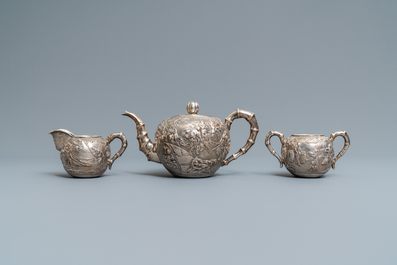 A Chinese silver teapot, cream jug and sugar jar, marked Luen Wo - Shanghai, late 19th C.