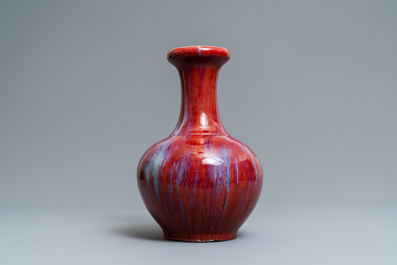 A Chinese monochrome flamb&eacute; sang-de-boeuf bottle vase, 19th C.