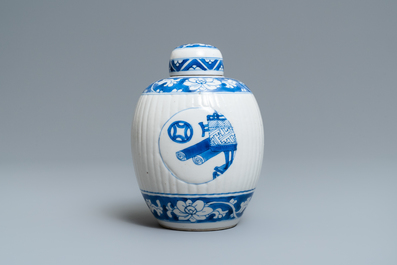 A Chinese ribbed blue and white jar and cover, Kangxi