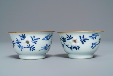Six Chinese blue, white and copper-red cups and saucers, Kangxi
