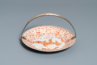 Three Chinese iron-red and gilt plates and a silver-mounted dish, Kangxi