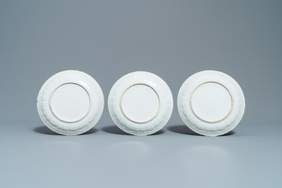 Three Chinese iron-red and gilt plates and a silver-mounted dish, Kangxi