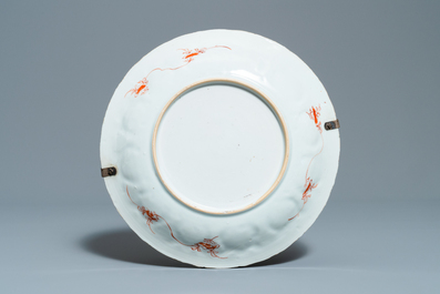 Three Chinese iron-red and gilt plates and a silver-mounted dish, Kangxi