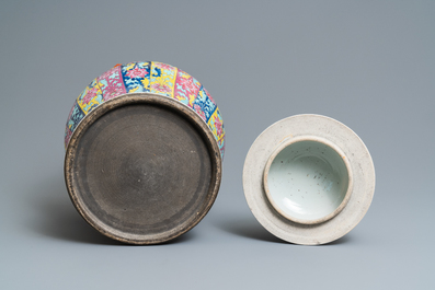A pair of large Chinese famille rose vases and covers, 19th C.