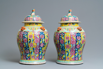 A pair of large Chinese famille rose vases and covers, 19th C.