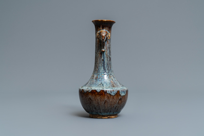 A Chinese flamb&eacute;-glazed vase with elephant head handles, 18/19th C.