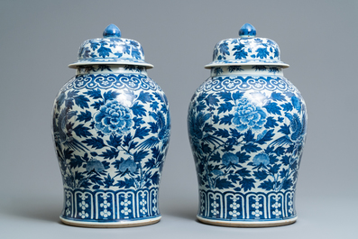 A pair of Chinese blue and white vases and covers with phoenixes, 19th C.