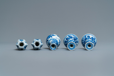 A pair of small Chinese blue and white candlesticks and three vases, Kangxi