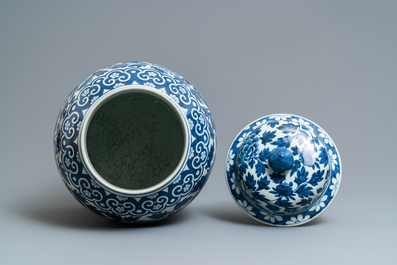 A pair of Chinese blue and white vases and covers with phoenixes, 19th C.