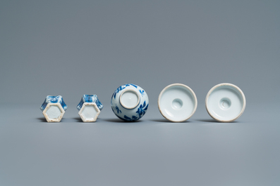 A pair of small Chinese blue and white candlesticks and three vases, Kangxi
