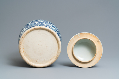 A pair of Chinese blue and white vases and covers with phoenixes, 19th C.