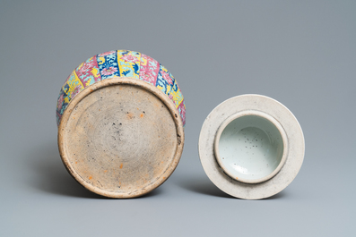 A pair of large Chinese famille rose vases and covers, 19th C.