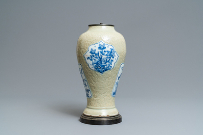 A Chinese blue and white on carved celadon-glazed ground vase, Kangxi