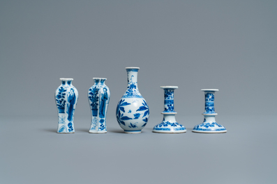 A pair of small Chinese blue and white candlesticks and three vases, Kangxi