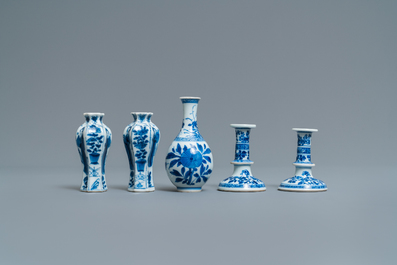 A pair of small Chinese blue and white candlesticks and three vases, Kangxi