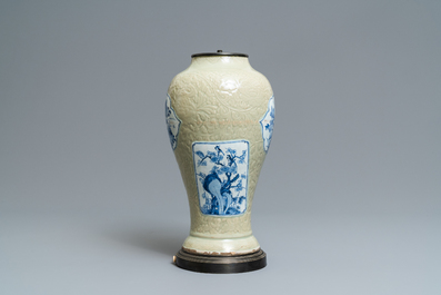 A Chinese blue and white on carved celadon-glazed ground vase, Kangxi