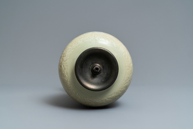 A Chinese blue and white on carved celadon-glazed ground vase, Kangxi