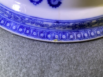 A Chinese blue and white bowl with an unusual scene with slaves, Qianlong