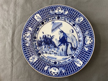 A Chinese blue and white dish after Cornelis Pronk: 'Dames au Parasol', Qianlong