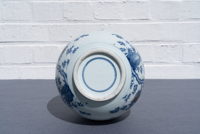 A Chinese blue, white and copper-red 'peaches' bottle vase with inscription, Kangxi