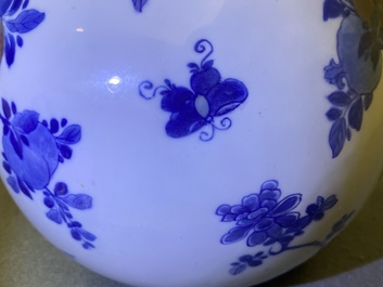 A Chinese blue, white and copper-red 'peaches' bottle vase with inscription, Kangxi